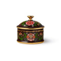 A small decorative porcelain lidded box with a dark burgundy base, gold trim, and hand-painted floral motifs in pink, green, and red, shown on a clean white background.