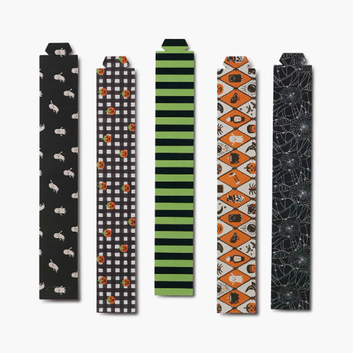 Five Halloween-themed decorative paper bands with different spooky patterns, displayed vertically on a light gray background.