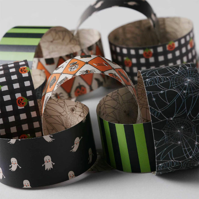 A group of Halloween-themed paper chain links with various spooky patterns including ghosts, pumpkins, spiderwebs, stripes, and checkers on a light gray background.