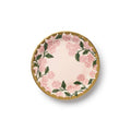 Pink hydrangea floral plate with gold foil scalloped edge, overhead view, on a white background.