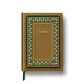 A hardcover journal with a textured mustard-yellow cover, featuring a decorative border of white flowers and green leaves, with the word 'JOURNAL' printed in gold in the center. A dark green ribbon bookmark is visible at the bottom left.