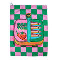 Green and pink checkerboard cotton tea towel with a sardine tin illustration, flat on a white background.
