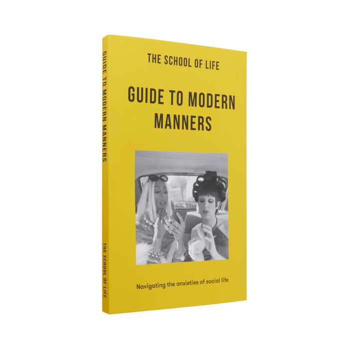 Yellow book cover of 'Guide to Modern Manners' by The School of Life on a white background.