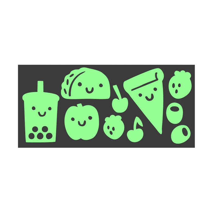 Set of green cartoon-style food illustrations on a black sticker sheet, on a white background.