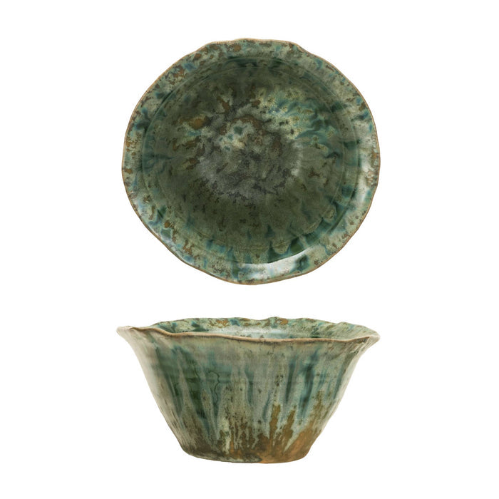 A small stoneware bowl with a scalloped rim, shown from two angles against a white background. The top view shows the interior with a mottled green and brown glaze, and the bottom view shows the exterior with a matching flared rim and textured glaze.