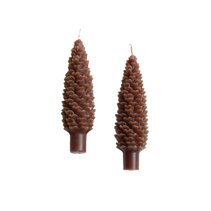 Set of 2 unscented paraffin wax taper candles that look like brown pinecones.