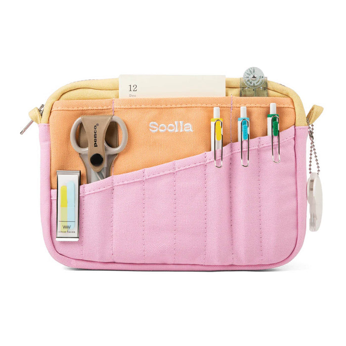Canvas pouch with multiple pockets on the front in pink, orange, and yellow, front view with pens, scissors, and other stationery items, on a white background.