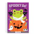 Spooky 8s! A Crazy 8s Card Game box by mudpuppy, featuring a purple background with a cartoon frog mummy sitting on a jack-o'-lantern pumpkin, with small Halloween icons including a ghost, spider, and stars.