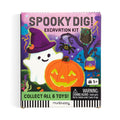 Spooky Dig! excavation kit packaging with ghost, pumpkin, and witch hat design on a colorful background.