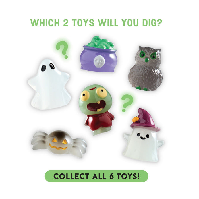 Six small Halloween-themed toy figurines are arranged on a white background with green text reading 'WHICH 2 TOYS WILL YOU DIG?' at the top and 'COLLECT ALL 6 TOYS!' at the bottom. The toys include a white ghost, a green cauldron with green contents, a gray owl, a green zombie, a silver spider, and a white ghost with a purple hat.