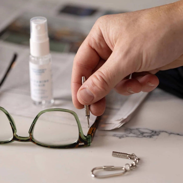 Gentlemen's Hardware Squeaky Clean eyeglass and screen cleaning and repair kit in use.