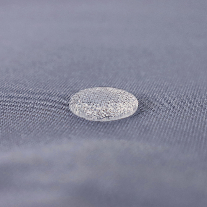 This WPC-Lite is in a muted blue-grey color. This photo shows a water drop on the fabric.
