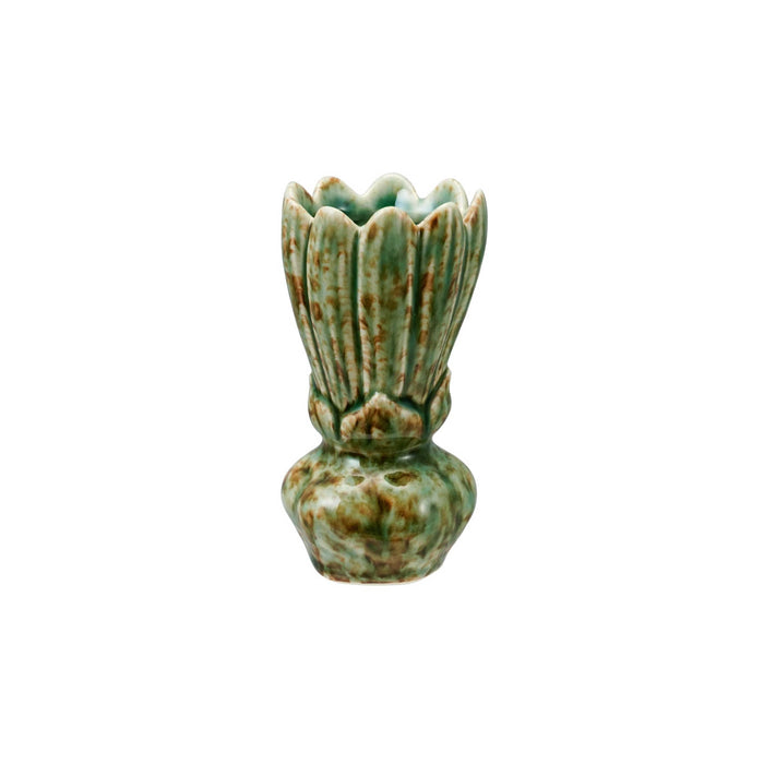 A small ceramic bud vase with a fluted, lotus-like top and a rounded base, covered in a speckled green and brown glaze, isolated on a white background.