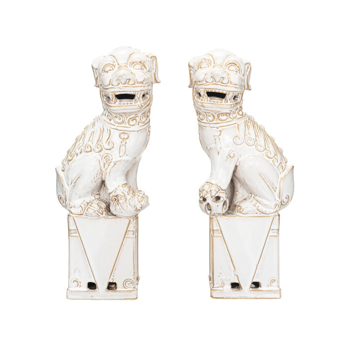 Pair of ceramic guardian lion statues with white glaze, on a white background.