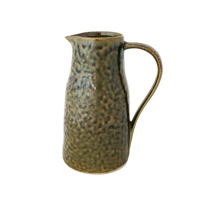A rustic stoneware pitcher featuring a dark olive green and brown glaze with subtle gold undertones, side view, against a plain white background.