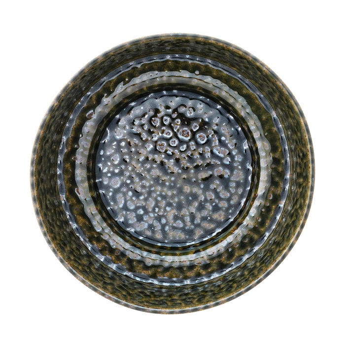 A large round ceramic bowl with a textured glaze in olive green and dark brown tones, overhead view, on a white background.