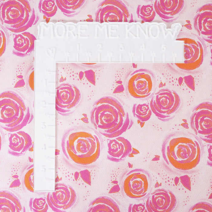 This printed WPC-Lite is of watercolor rose in pink and orange. This photo shows a white L shaped ruler for scale.