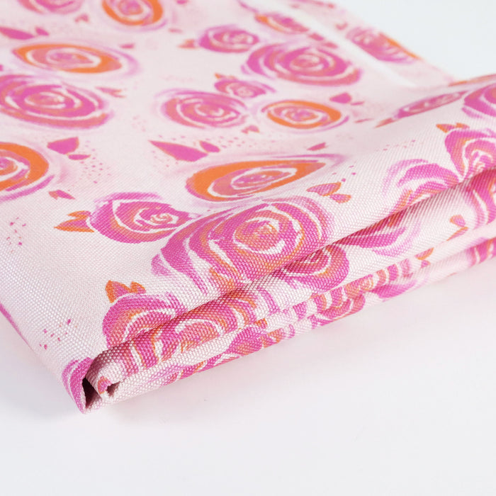 This printed WPC-Lite is of watercolor rose in pink and orange. This photo shows the fabric folded.