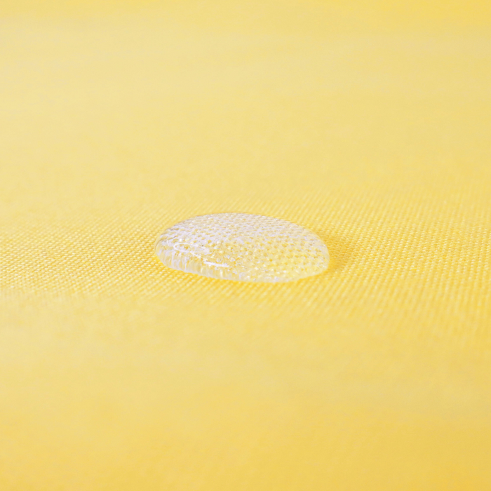 This WPC-Lite is in a bright sunny yellow. This photo has a water drop on the fabric.