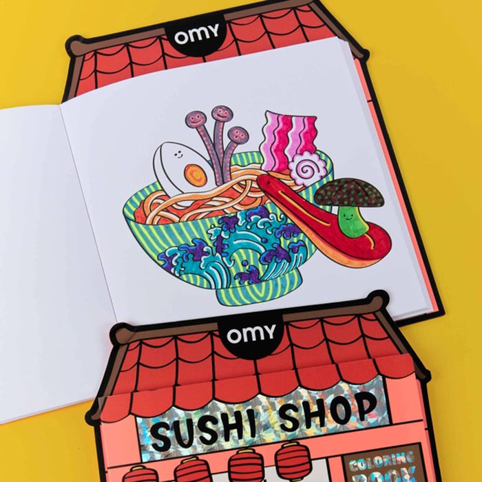 Coloring book shown open with a sushi-themed design on a yellow background.