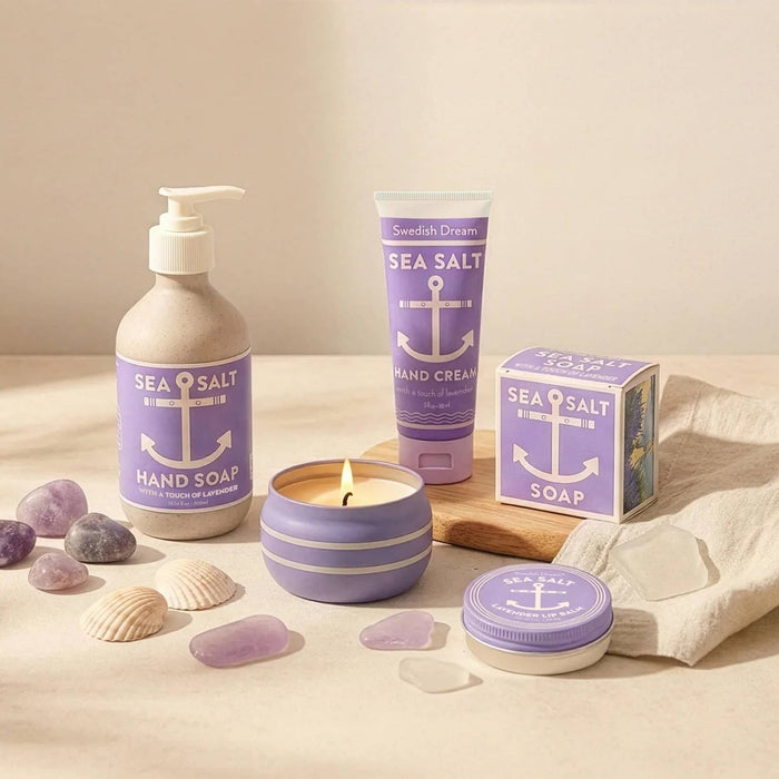 Lavender Sea Salt themed hand care products including soap, cream, and candle on a neutral background.