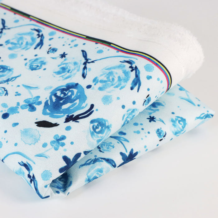 This printed WPC-Lite is of watercolor flowers in teal tones. This photo shows the fabric folded.