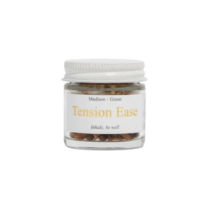 Tension Ease aromatherapy inhaler in a glass jar, front view, on a white background.