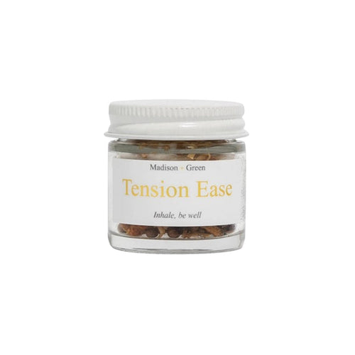Tension Ease aromatherapy inhaler in a glass jar, front view, on a white background.