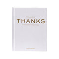 The Book of Thanks: A Catalogue of Gratitude, a hardcover book with a textured off-white cover and gold foil lettering, shown on a plain white background.