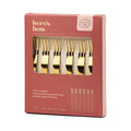 Packaging of gold stainless steel appetizer forks with 'here's how' branding.