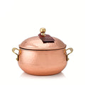 Simmered Cider scented candle in a copper pot with a lid on a white background.