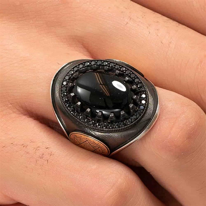 Rooted in centuries of symbolism, this Turkish Sterling Silver Ring with Black Onyx Suleyman Seal features the iconic Seal of Solomon motif set against a deep black onyx stone.