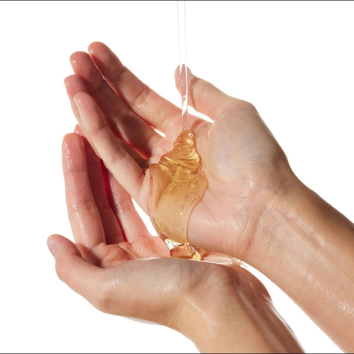 Ursa Major Botanic Buzz Hand Wash, being poured into hands to show texture.
