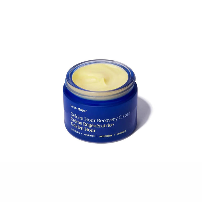 Ursa Major Golden Hour Recovery Cream in blue glass jar, lid off.
