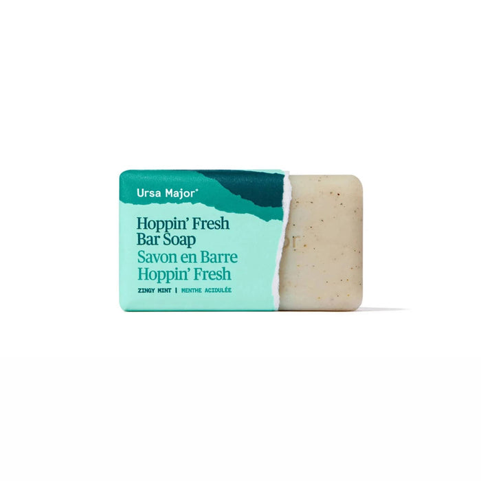 Ursa Major Hoppin' Fresh Bar Soap in green paper wrapping, end torn off to show the bar.