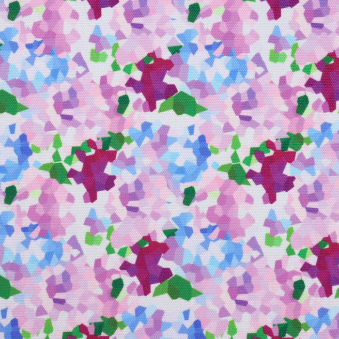 This printed WPC shows geometric shapes to resemble bunches of flowers. The colors are in an array of pinks, blues, and greens on a white background.