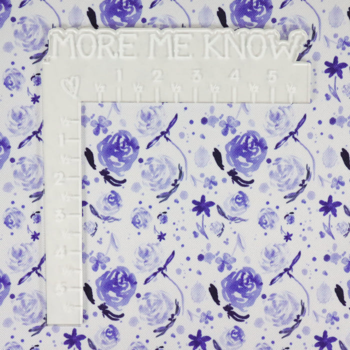This printed WPC is of watercolor flowers in blue tones. This photo shows a white L shaped ruler for scale.