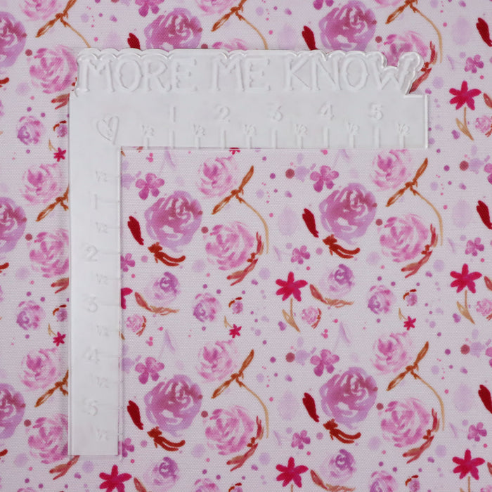 This printed WPC-Lite is of watercolor flowers in pink tones. This photo shows a white L shaped ruler for scale.