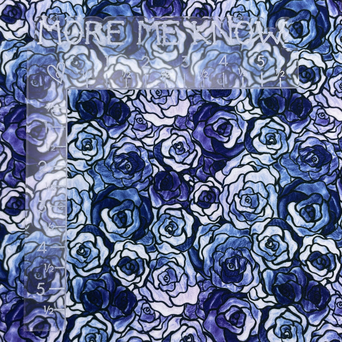 This printed WPCotton has roses that vary in shades of blue. This photo shows an L shaped ruler for scale.