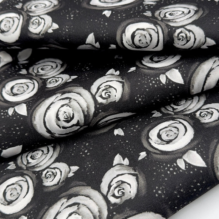 This printed WPCotton has a white rose design on a black backrdrop.