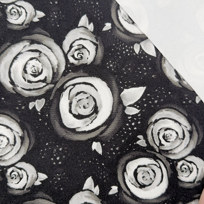 This printed WPCotton has a white rose design on a black backrdrop.