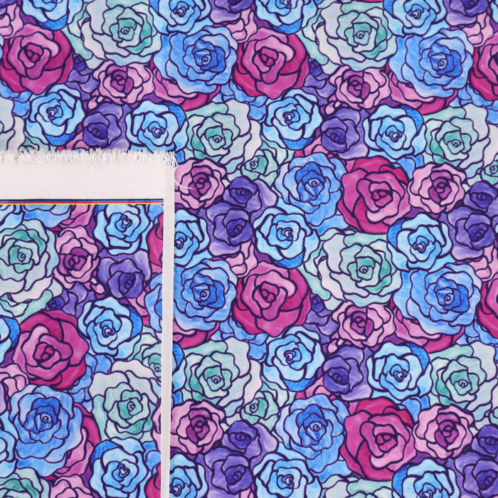 This printed WPCotton has a rose design varying in shades of blue, green, purple, and pink.