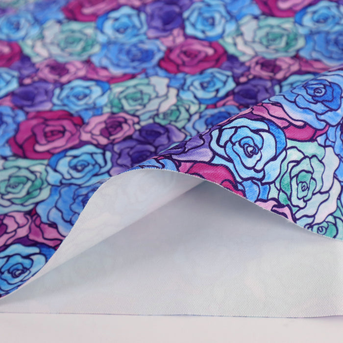 This printed WPCotton has a rose design varying in shades of blue, green, purple, and pink.