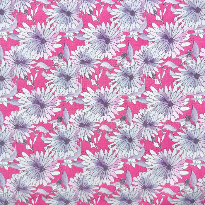 This printed WPCotton features daisy flowers in hues of pink and purple on a saturated pink background.