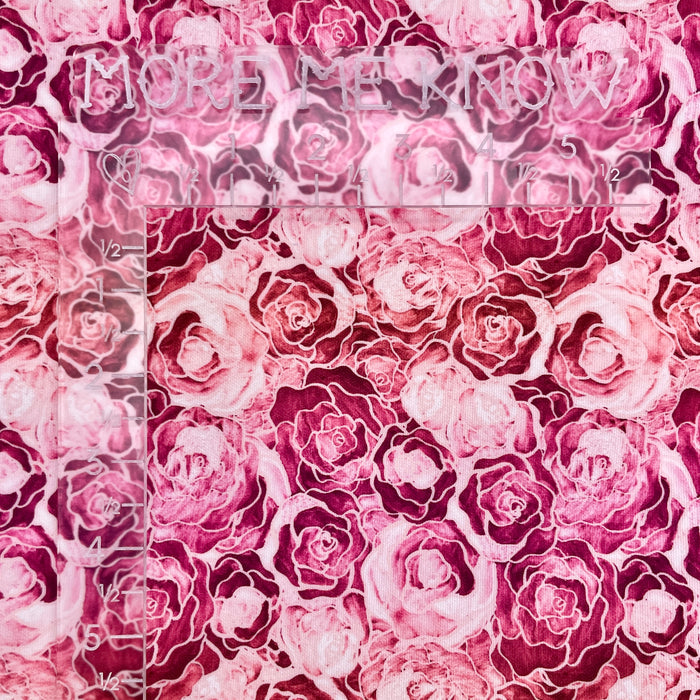 This printed WPCotton has roses that vary in shades of pink. This photo shows an L shaped ruler for scale.