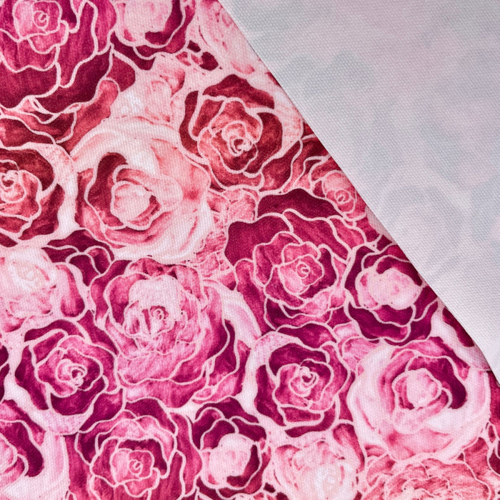 This printed WPCotton is of roses varying in shades of pinks and red.