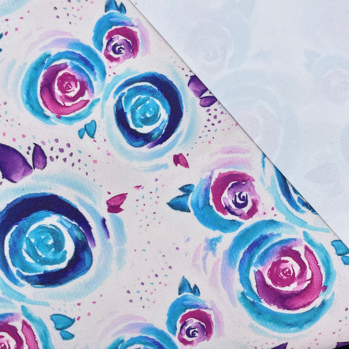 This printed WPCotton features watercolor roses in shades of blue and pink on a pale background.