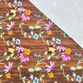 This printed WPCotton consists of different colorful flowers on a wood-esque background.